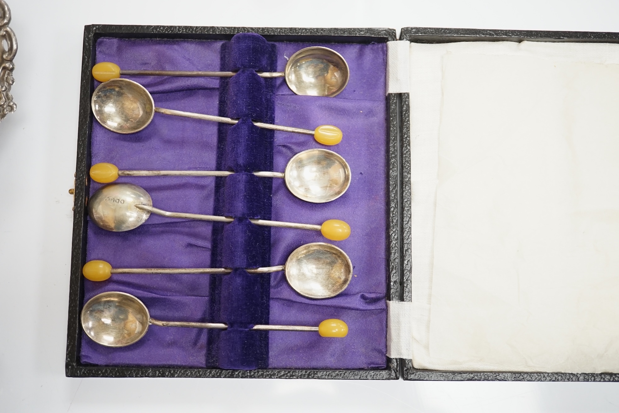 An Elizabeth II silver quatrefoil dish by James Dixon & Sons, Sheffield, 1967, 14.2cm, together with a silver spoon and pusher, silver bonbon dish, pair of silver wishbone nips and a cased set of plated spoons. Condition